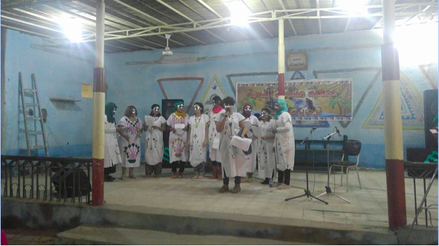 Women wearing masks and singing in Upper Egypt